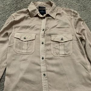 A brand new long sleeve tan button down